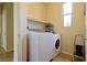 Functional laundry room featuring a modern washer and dryer set and ample storage space at 2079 Port Royal Dr, Laughlin, NV 89029