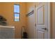Laundry room with a window and door, equipped with a washer and dryer at 2079 Port Royal Dr, Laughlin, NV 89029