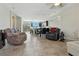 Spacious living area featuring tile flooring, recessed lighting, and a seamless flow to the kitchen at 2079 Port Royal Dr, Laughlin, NV 89029