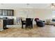 Inviting living space with tile floors, modern furnishings, and a seamless flow between dining and living areas at 2079 Port Royal Dr, Laughlin, NV 89029