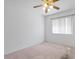 This is a carpeted bedroom with a ceiling fan and a window at 2154 Eagle Sticks Dr, Henderson, NV 89012