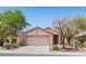 Charming single-story home featuring a well-maintained yard, mature trees, and an attached two-car garage at 2154 Eagle Sticks Dr, Henderson, NV 89012
