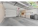 Spacious three-car garage with built-in storage cabinets and room for a workbench at 2154 Eagle Sticks Dr, Henderson, NV 89012