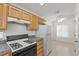 Well-lit kitchen featuring modern appliances, granite countertops, and ample cabinet space at 2154 Eagle Sticks Dr, Henderson, NV 89012