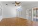 Hardwood floors and sliding glass doors add light to this expansive living room at 2154 Eagle Sticks Dr, Henderson, NV 89012