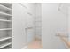 Bright walk-in closet featuring custom shelving and ample storage space at 2154 Eagle Sticks Dr, Henderson, NV 89012