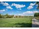 Lush community greenbelt, featuring an expansive lawn, mature trees, and walking path at 2198 Maderno St, Henderson, NV 89044