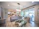 Elegant living room featuring stylish furniture, tile flooring, and sliding glass doors leading to the backyard at 2198 Maderno St, Henderson, NV 89044