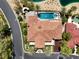 Aerial view of backyard featuring a large pool, patio, and lush landscaping in a gated community at 2200 Glenbrook Way, Las Vegas, NV 89117