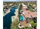 Aerial view of a gorgeous backyard pool and patio area and the water features of this desert community at 2200 Glenbrook Way, Las Vegas, NV 89117