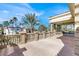 Backyard view with a patio area, lush landscaping, and a view of the neighborhood at 2200 Glenbrook Way, Las Vegas, NV 89117