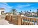 Balcony view overlooking the water, other homes, and palm trees in a serene setting at 2200 Glenbrook Way, Las Vegas, NV 89117