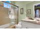 Bathroom features a tiled shower with glass door and single sink vanity at 2200 Glenbrook Way, Las Vegas, NV 89117