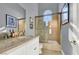 Bathroom with granite vanity, glass enclosed shower, and modern fixtures at 2200 Glenbrook Way, Las Vegas, NV 89117