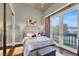 Relaxing bedroom with walk-in closet, and sliding glass doors to a balcony with a view at 2200 Glenbrook Way, Las Vegas, NV 89117