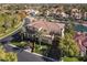 Beautifully landscaped home featuring a well-maintained lawn, mature trees, and meticulous shrubbery at 2200 Glenbrook Way, Las Vegas, NV 89117