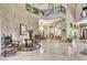 A grand foyer with soaring ceilings, elegant chandelier, and marble floors offers a luxurious welcome at 2200 Glenbrook Way, Las Vegas, NV 89117