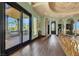 Hallway with hardwood floors, decorative ceilings, and access to balcony with outdoor views at 2200 Glenbrook Way, Las Vegas, NV 89117
