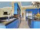 Well-lit kitchen with blue cabinets, stainless steel appliances, and a sleek black countertop at 2200 Glenbrook Way, Las Vegas, NV 89117