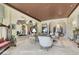 A spacious living room featuring a sitting area and arches, showcasing the home's open layout at 2200 Glenbrook Way, Las Vegas, NV 89117