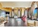 Spacious primary suite with fireplace, balcony access, and custom window treatments at 2200 Glenbrook Way, Las Vegas, NV 89117