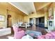 Elegant main bedroom with luxurious seating, fireplace, and decorative ceiling at 2200 Glenbrook Way, Las Vegas, NV 89117