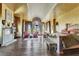 Spacious primary bedroom with fireplace, decorative ceiling, and an abundance of natural light at 2200 Glenbrook Way, Las Vegas, NV 89117