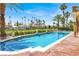 Stunning pool area with palm trees and manicured landscaping, perfect for outdoor enjoyment at 2200 Glenbrook Way, Las Vegas, NV 89117