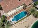 Overhead view of private pool with a spa surrounded by lush landscaping, and a covered patio at 2200 Glenbrook Way, Las Vegas, NV 89117