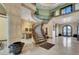 A grand staircase with wrought iron railing and marble floors adds elegance to the home's interior at 2200 Glenbrook Way, Las Vegas, NV 89117