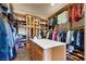 Large walk-in closet with custom shelving, drawers, and ample storage space at 2200 Glenbrook Way, Las Vegas, NV 89117