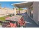 Comfortable backyard patio has a table with seating and is perfect for outdoor living at 2229 Bowstring Dr, Las Vegas, NV 89142