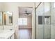 Ensuite bathroom features tile and glass shower with open view of bedroom at 2229 Bowstring Dr, Las Vegas, NV 89142