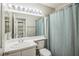 Bathroom includes vanity, toilet, and shower with blue curtain at 2229 Bowstring Dr, Las Vegas, NV 89142