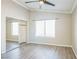 Neutral bedroom features plank flooring, window and closet with mirror doors at 2229 Bowstring Dr, Las Vegas, NV 89142