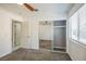 Bedroom includes carpet flooring, ceiling fan, closet and exterior view at 2229 Bowstring Dr, Las Vegas, NV 89142