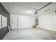 Spacious two car garage with epoxy flooring, an insulated door, and utility access at 2229 Bowstring Dr, Las Vegas, NV 89142