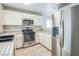 Bright kitchen featuring stainless steel appliances, modern cabinetry, and a window with natural light at 2229 Bowstring Dr, Las Vegas, NV 89142