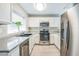 Bright kitchen featuring stainless steel appliances, modern cabinetry, and a window with natural light at 2229 Bowstring Dr, Las Vegas, NV 89142