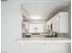 Bright kitchen with modern stainless steel appliances and a convenient pass-through bar to dining area at 2229 Bowstring Dr, Las Vegas, NV 89142