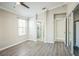 Spacious main bedroom with modern light fixture, walk-in closet and ensuite bathroom with shower at 2229 Bowstring Dr, Las Vegas, NV 89142