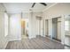 Spacious main bedroom with wood floors, a closet with mirrored doors, and ensuite bathroom access at 2229 Bowstring Dr, Las Vegas, NV 89142