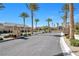 Gated community entrance showcasing manicured landscaping and palm trees at 2404 Elmont Ave, North Las Vegas, NV 89086