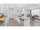 Bright kitchen featuring granite countertops, stainless appliances and a dining table at 2404 Elmont Ave, North Las Vegas, NV 89086