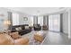 Comfortable living room with grey walls, wood floors, and a cozy seating arrangement at 2404 Elmont Ave, North Las Vegas, NV 89086
