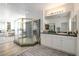 A luxurious bathroom with a double vanity, walk-in shower, and soft, neutral tones at 2496 Ram Crossing Way, Henderson, NV 89074