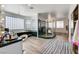 Elegant bathroom with a glass block window, a soaking tub, and a walk-in shower at 2496 Ram Crossing Way, Henderson, NV 89074
