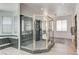 Large bathroom featuring a walk-in shower, dual vanities, and ample natural light at 2496 Ram Crossing Way, Henderson, NV 89074