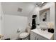 This is a well-lit half bathroom with white walls, modern fixtures, and textured walls at 2496 Ram Crossing Way, Henderson, NV 89074