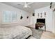 This is a bright bedroom with a ceiling fan that offers lots of closet space and a desk at 2496 Ram Crossing Way, Henderson, NV 89074